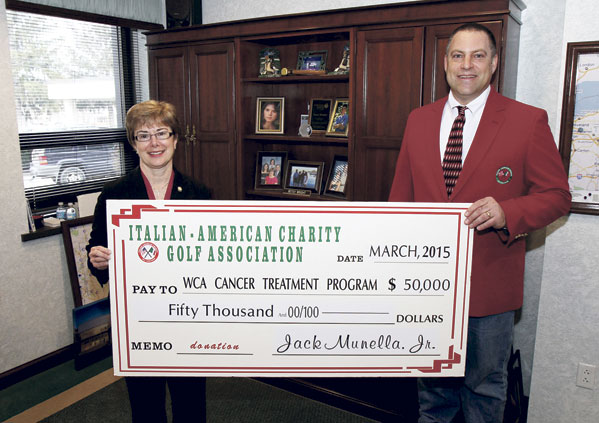 Jack Munella, Jr., chair of the Italian American Charity Golf Association, presents a check in the amount of $50,000 to Betsy Wright, WCA Hospital president/CEO, representing the proceeds from the Italian American’s 2014 fundraising activities and the second installment of a three-year, $150,000 pledge to enhance local cancer care at WCA Hospital through the purchase of a Fluoroscopic C-Arm.